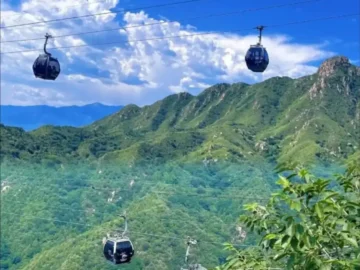 Badaling Great Wall cable cars over green mountains