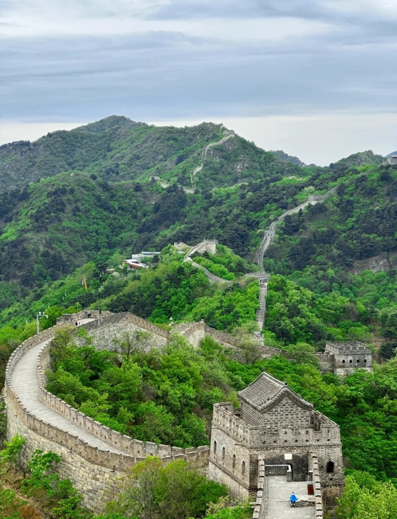 Great Wall watchtower with green spring slopes