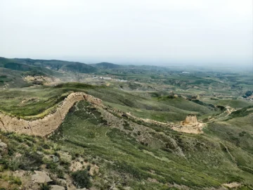 Jin Great Wall remains stretching over low hills