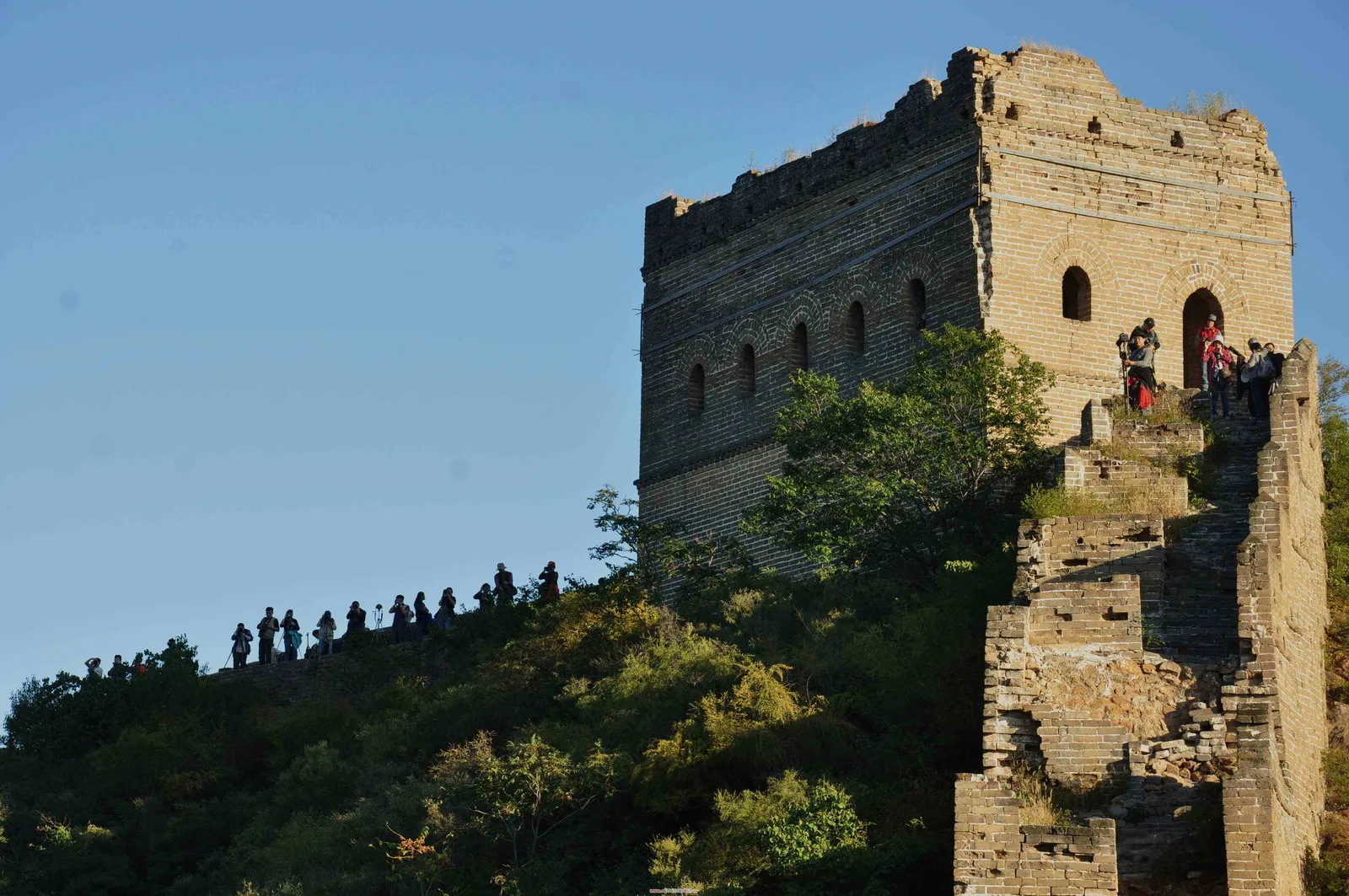 Old Great Wall watchtower on a green ridge