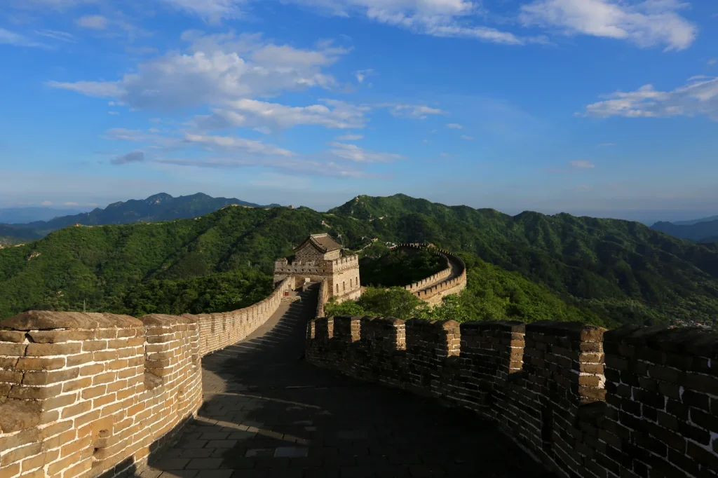 Sunny Mutianyu Great Wall watchtower and green summer mountains