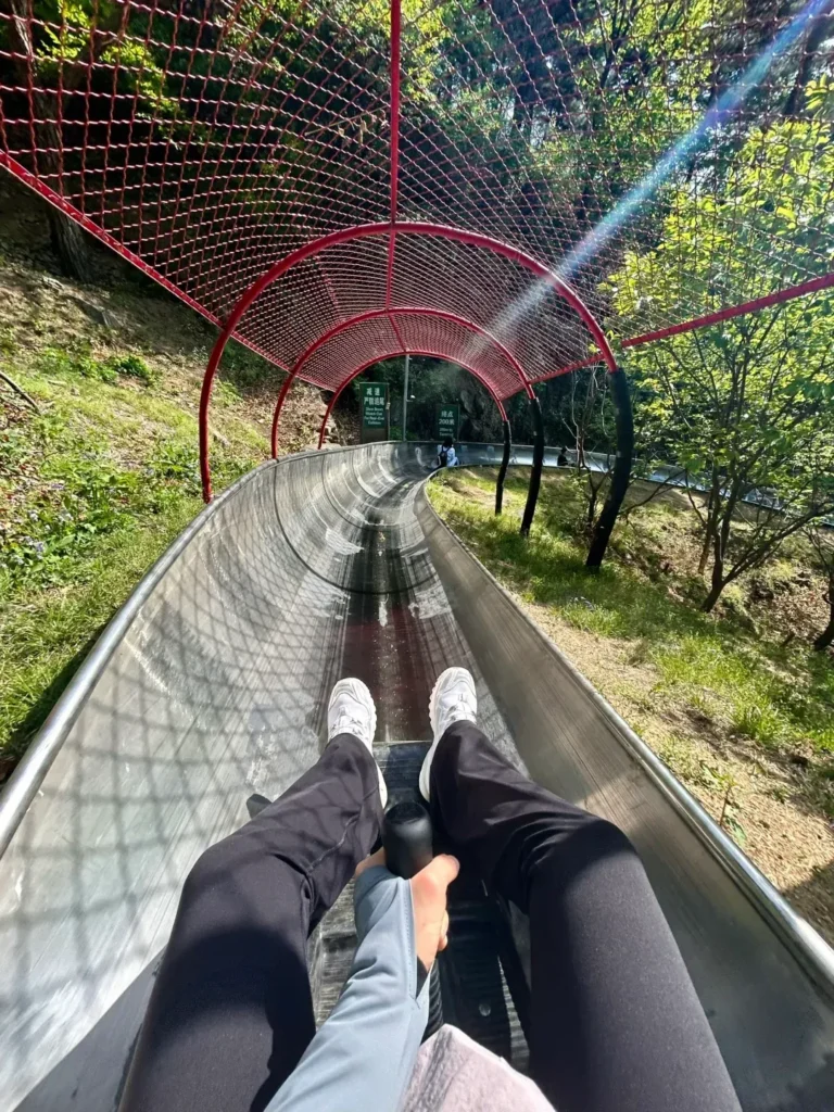 Riding the Mutianyu Great Wall slide rail down the hill