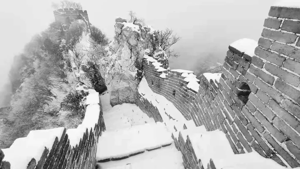 Unrestored Jiankou Great Wall ridge in winter snow
