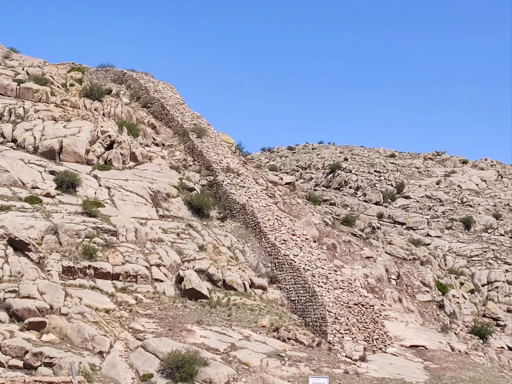 Ancient stonework ruins on a dry Great Wall slope