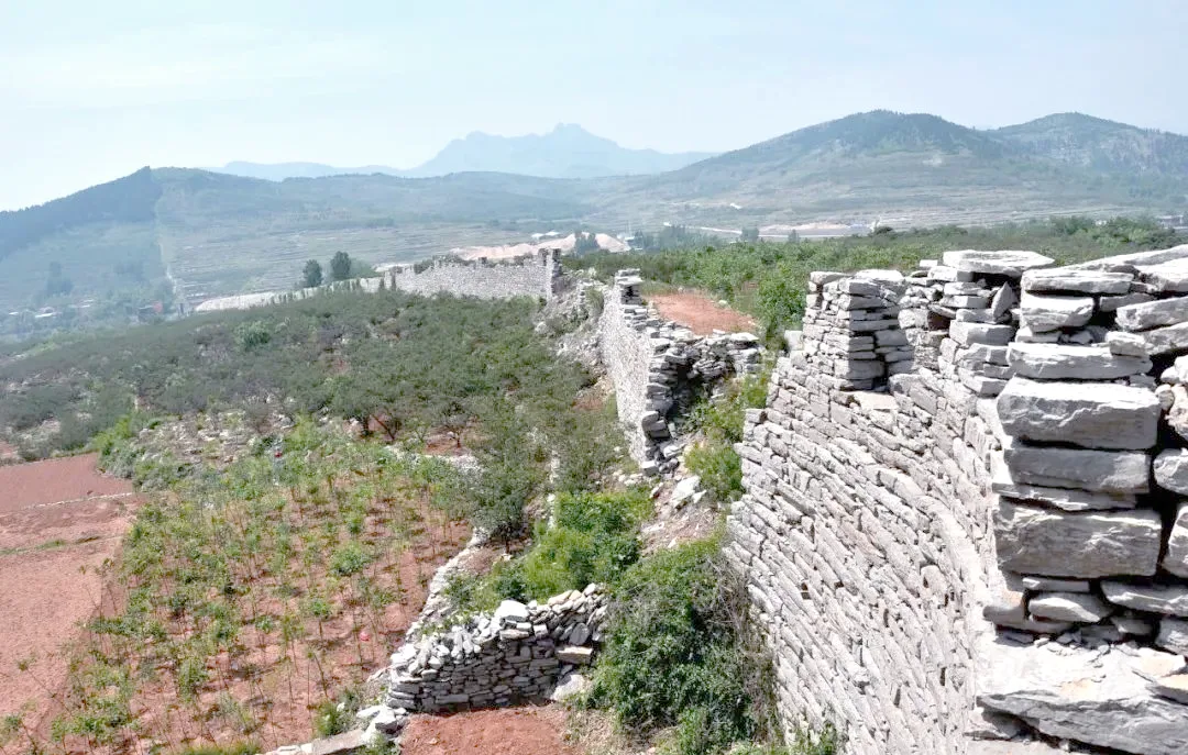 Stone Great Wall remains along a mountain ridge