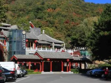 Mutianyu Great Wall arrival area with parking and visitor buildings for layover timing