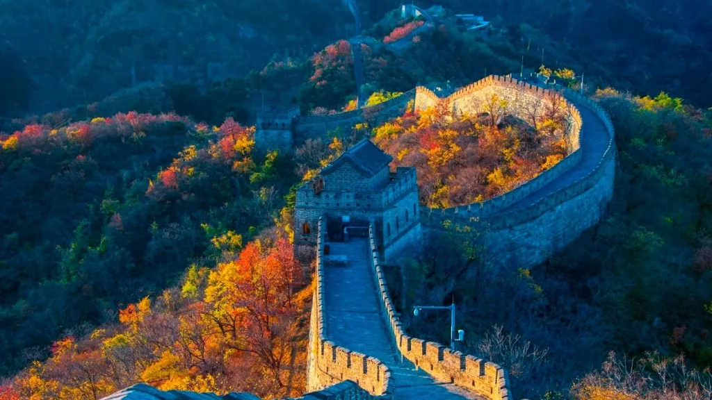 Mutianyu Great Wall watchtower ridge with autumn color for a scenic layover visit