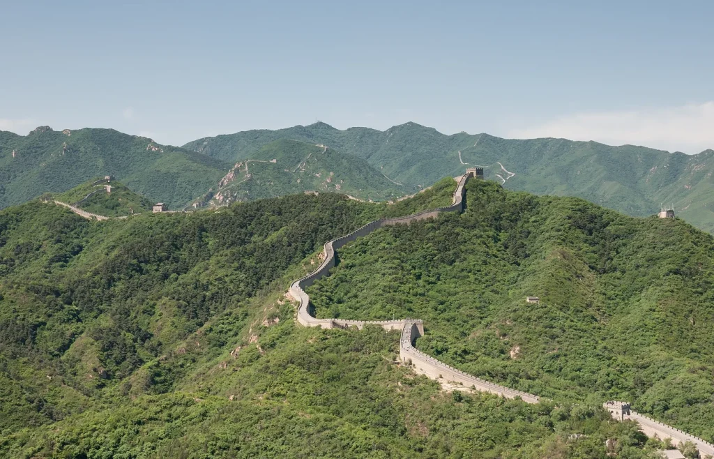Badaling Great Wall running along green mountain ridges near Beijing