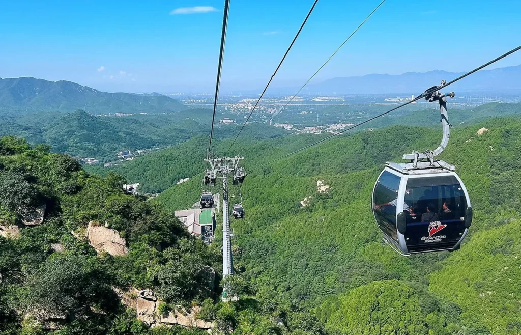 Badaling Great Wall cable car over green mountain valley for visitors planning an easier route