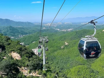 Badaling Great Wall cable car over green mountain valley for visitors planning an easier route