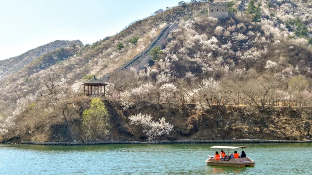 Boat on the Huanghuacheng Water Great Wall lake with autumn hills