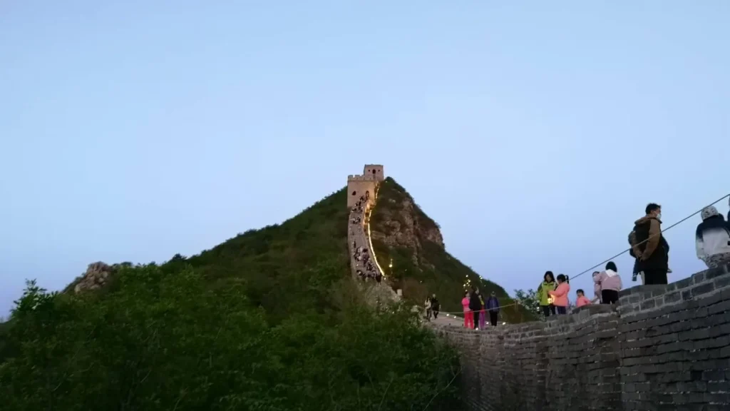 Simatai Great Wall steep wall section with a watchtower above the ridge