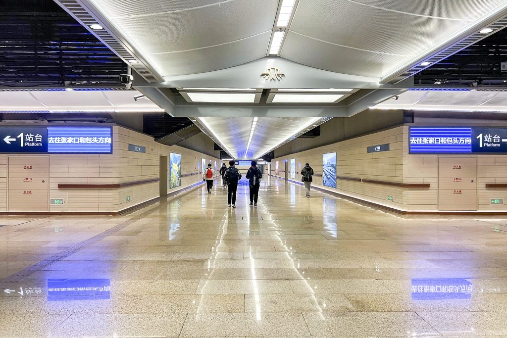 Travelers walking through the platform hall at Badaling Great Wall Railway Station