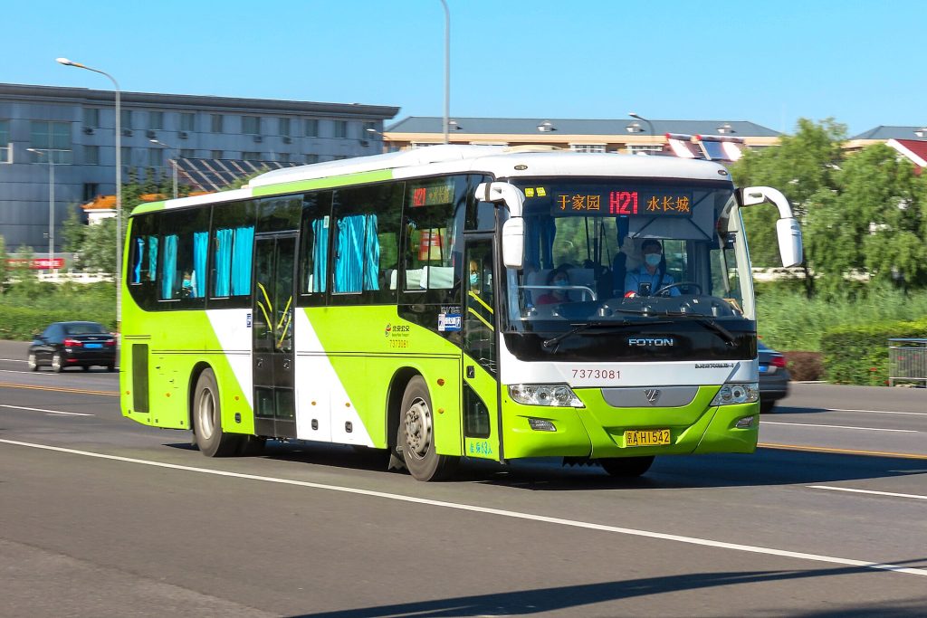 A public bus travelling in Huairou near Great Wall travel routes