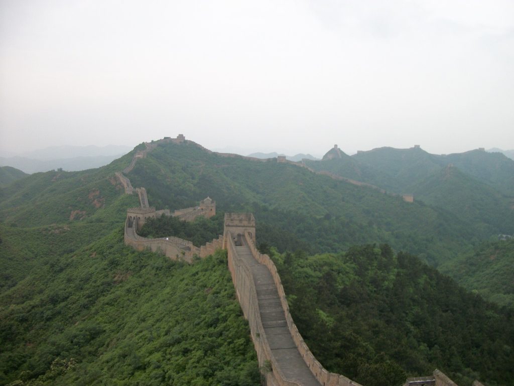 Jinshanling Great Wall winding along forested mountain ridges