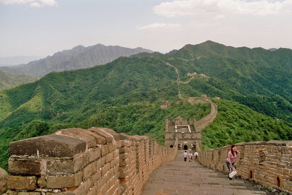 Mutianyu Great Wall stretching across green mountain ridges