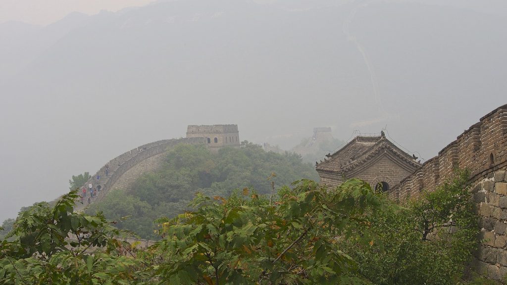 Mutianyu Great Wall watchtowers in a hazy mountain scene