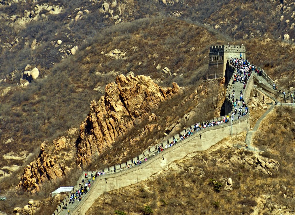 Crowds walking toward a watchtower on the Badaling North Route