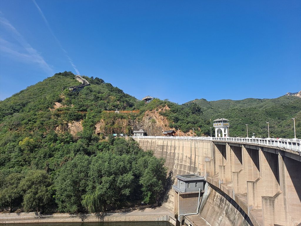Reservoir dam and bridge below the green hills and Wall at Huanghuacheng
