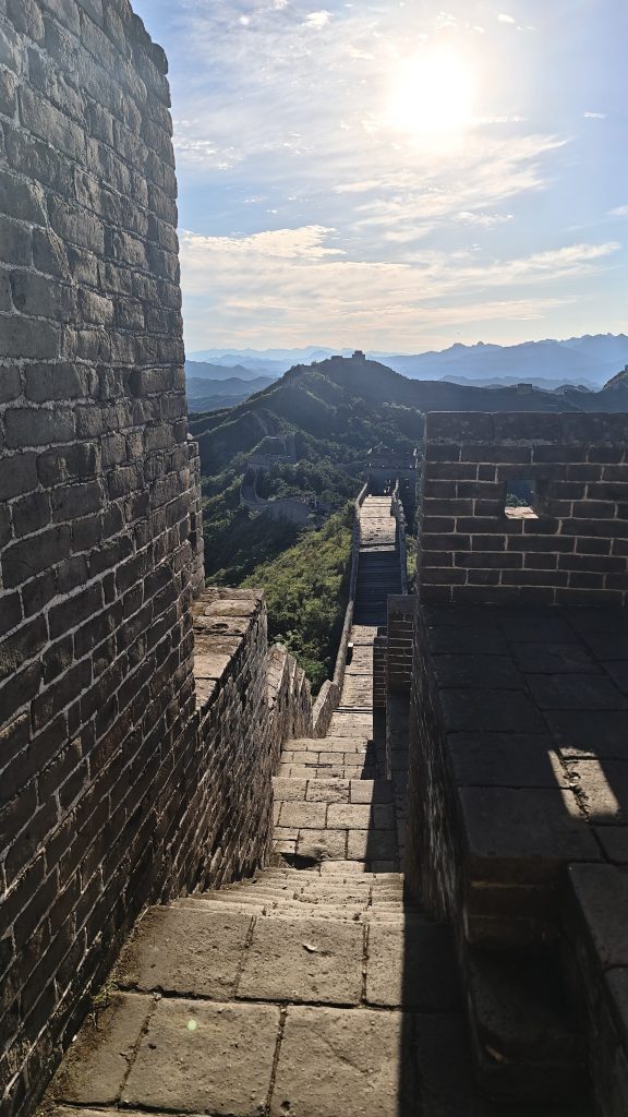 Stone steps beside a watchtower on Jinshanling Great Wall in September 2026