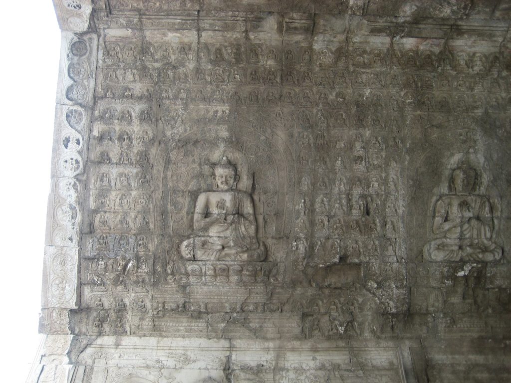 Weathered Buddhist carvings on the Cloud Platform passage ceiling