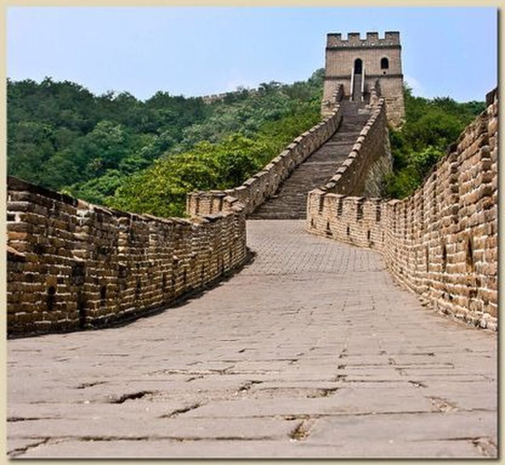 Steep stone steps rising toward a watchtower at Mutianyu Great Wall
