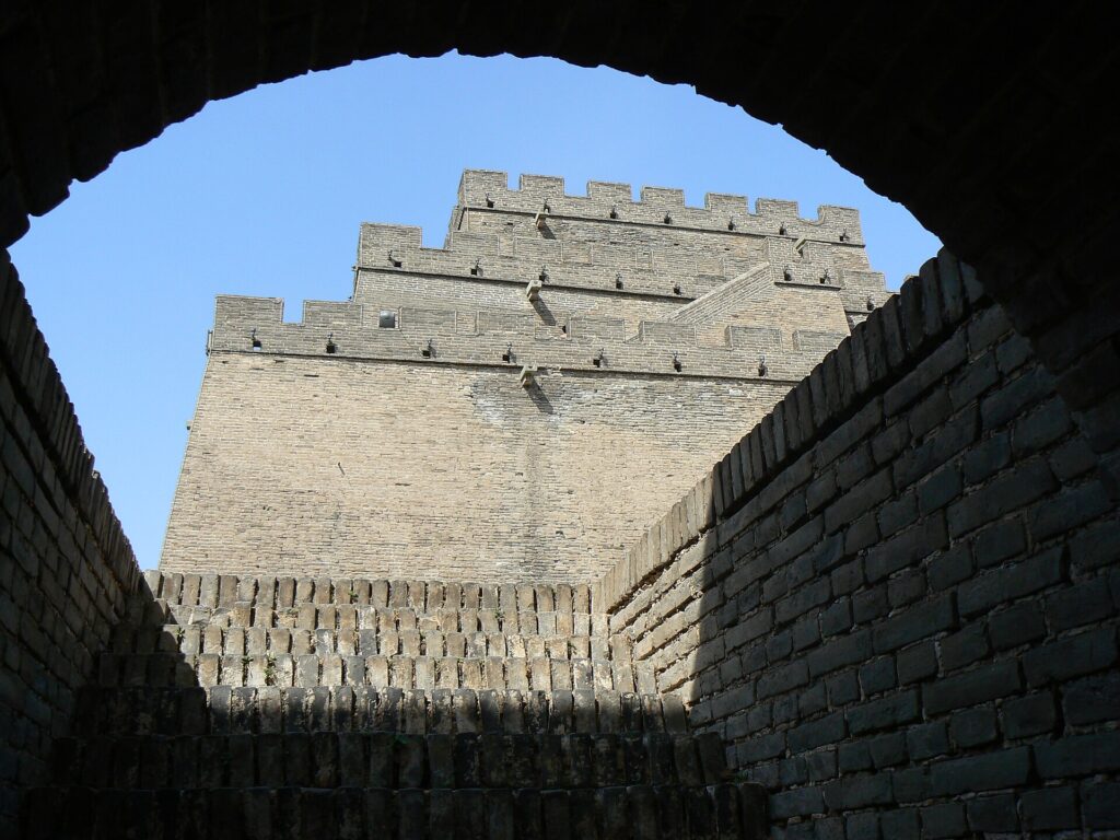 Upper tiers of Zhenbeitai seen through a brick archway